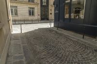 a bicycle that is sitting in the middle of a street in paris by a building