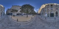 360 - lens image of a street scene in paris, france in the afternoon with some street light in the foreground