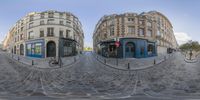 two street images of buildings and bicycles on cobblestone pavements in paris, france