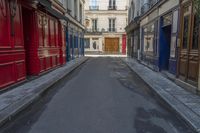 a narrow alley with colorful doors in an alley way in paris france photo by hide away studios