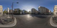 360 - angle photograph of paris street during the day and night with an empty road