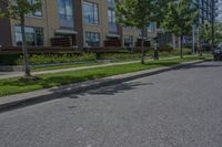 parked cars are on the street next to the houses and trees and a blue sky with white clouds