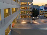 a view of a road and an overpass with traffic passing through it by buildings