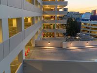 a view of a road and an overpass with traffic passing through it by buildings