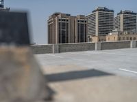 a parking lot and wall are pictured in a photo from the perspective point of view