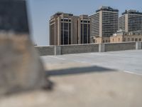 a parking lot and wall are pictured in a photo from the perspective point of view