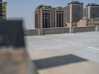 a parking lot and wall are pictured in a photo from the perspective point of view