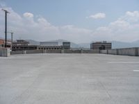 a parking lot and wall are pictured in a photo from the perspective point of view