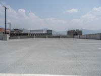 a parking lot and wall are pictured in a photo from the perspective point of view