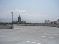 a parking lot and wall are pictured in a photo from the perspective point of view