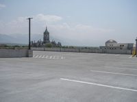 a parking lot and wall are pictured in a photo from the perspective point of view