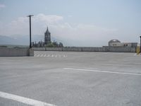 a parking lot and wall are pictured in a photo from the perspective point of view