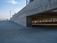 several large empty parking spaces in the city with buildings nearby in front of them -