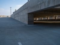 several large empty parking spaces in the city with buildings nearby in front of them -