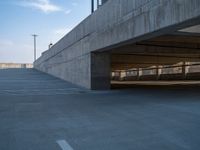 several large empty parking spaces in the city with buildings nearby in front of them -