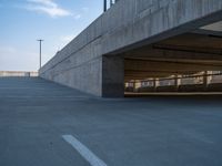 several large empty parking spaces in the city with buildings nearby in front of them -