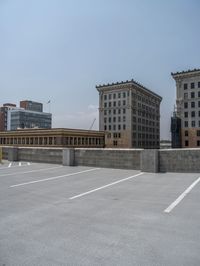 a parking lot and wall are pictured in a photo from the perspective point of view