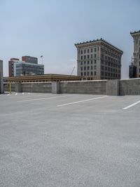 a parking lot and wall are pictured in a photo from the perspective point of view