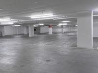 a large parking garage is empty and ready for customers to use the space for storage