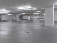 a large parking garage is empty and ready for customers to use the space for storage