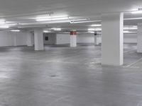 a large parking garage is empty and ready for customers to use the space for storage