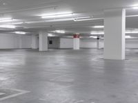 a large parking garage is empty and ready for customers to use the space for storage