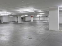 a large parking garage is empty and ready for customers to use the space for storage