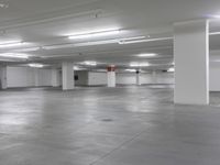 a large parking garage is empty and ready for customers to use the space for storage