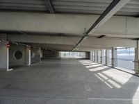 there is a parking garage with metal flooring and a walkway in between it's two bales