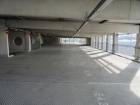 there is a parking garage with metal flooring and a walkway in between it's two bales