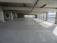 there is a parking garage with metal flooring and a walkway in between it's two bales