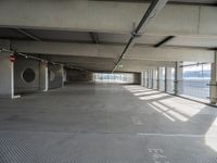 there is a parking garage with metal flooring and a walkway in between it's two bales