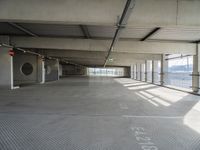 there is a parking garage with metal flooring and a walkway in between it's two bales