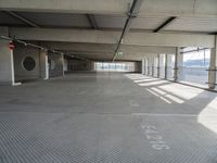 there is a parking garage with metal flooring and a walkway in between it's two bales