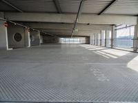 there is a parking garage with metal flooring and a walkway in between it's two bales