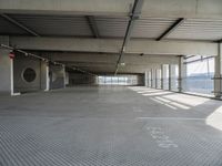 there is a parking garage with metal flooring and a walkway in between it's two bales