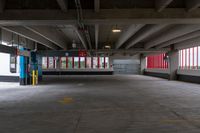 the inside of a parking garage with only red and white painted wallpapers in it