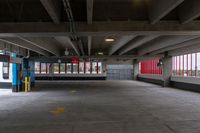 the inside of a parking garage with only red and white painted wallpapers in it