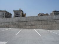 a parking lot and wall are pictured in a photo from the perspective point of view