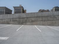 a parking lot and wall are pictured in a photo from the perspective point of view