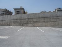 a parking lot and wall are pictured in a photo from the perspective point of view