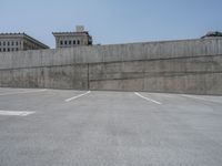 a parking lot and wall are pictured in a photo from the perspective point of view