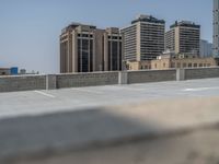 a parking lot and wall are pictured in a photo from the perspective point of view