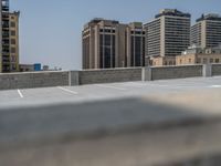 a parking lot and wall are pictured in a photo from the perspective point of view