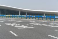 an airport parking lot with car parking spaces on the opposite sides of it in china