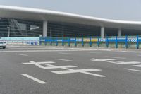an airport parking lot with car parking spaces on the opposite sides of it in china