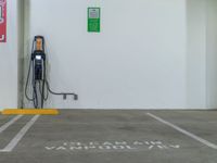 an electric car charging station is located in a building with the words clean air and vandalized