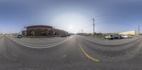 a 360 degree view of a parking lot taken with a fish eye lens on camera