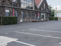 several parking spaces are set up outside a building for public use, with no parking sign posts on them