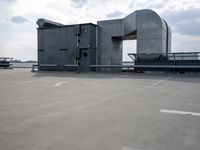 a boat is parked in an empty parking lot near an air port on the water